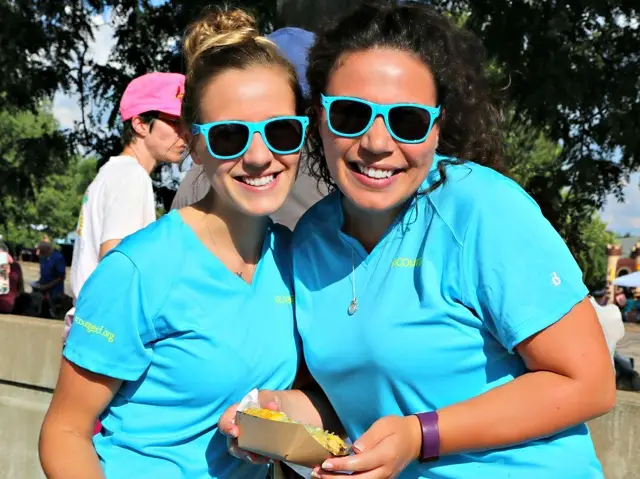 Two women in sunglasses smiling