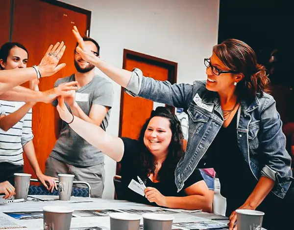Image of group high-fiving