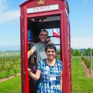 Couple standing in telephone booth