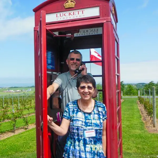 Couple standing in telephone booth