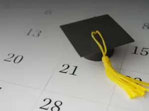 Photo of graduation cap and a calendar